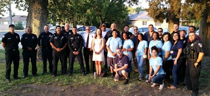 Group of Police & Youth Coalition group shot set against trees in park