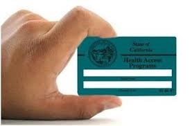 Hand holding green card for Family PACT insurance