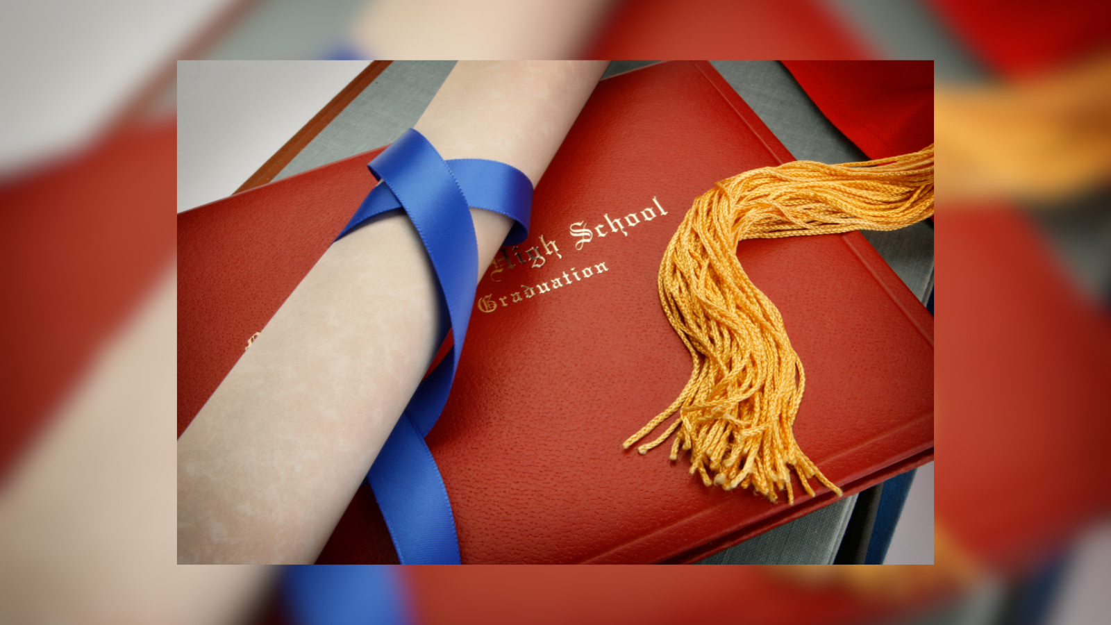 rolled up paper diploma and a red diploma sleeve that reads high school diploma